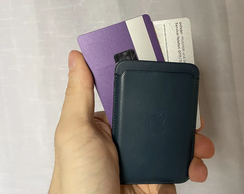 Apple wallet with cards in hand