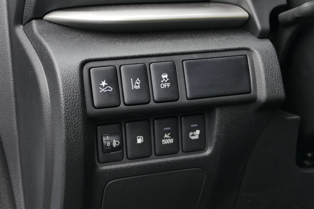 Mitsubishi buttons next to the steering wheel